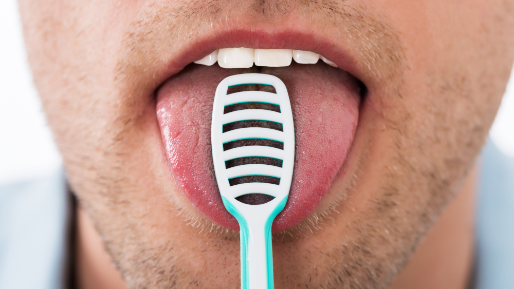 what is the benefit of brushing your tongue