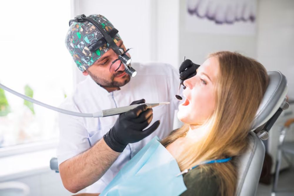 dentist performing modern root canal therapy to treat an infected tooth and preserve the natural tooth