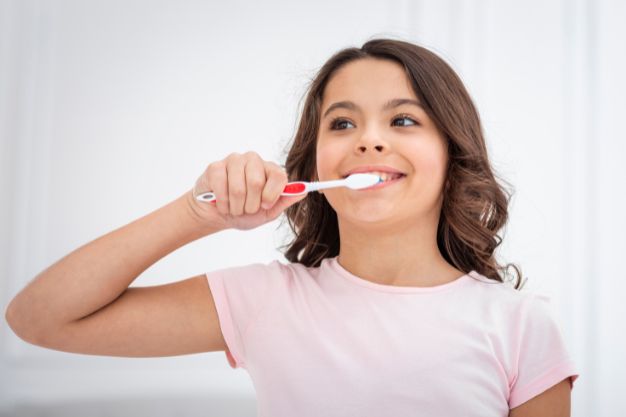 child brushing teeth for cavity prevention